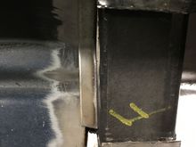 I cut and bent some heavy gauge sheet metal to fill the gap.