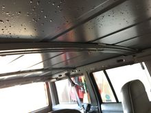 A little tip, put some weatherstripping between the roof and the two cross supports, seriously helped with the rattles and clanks until I get the headliner back in 