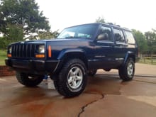 2000 Jeep Cherokee Patriot Blue 2" lift, 31" Goodyear Wrangler Authority, painted bumper caps, removed door trim