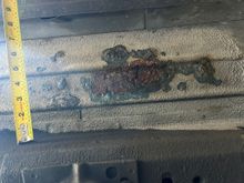 rust under passenger side floor pan --may have leaked in from radio antenna, and pooled up under carpet