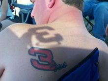 That's my Earnhardt tat. The shadow is from the Angel Earnhardt decal on the back window of my '98. Chicagoland Cup race, 2007.