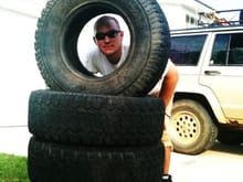 My new 31'' BFG All-Terrains. 30% Tread for 80 bucks

My buddy Taylor, in the center of the tire. 
hahahaha.