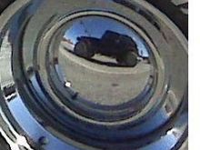 short jeep reflection of hubcap on a T-bucket roadster