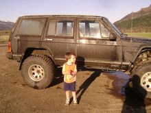 The nephew posing with the jeep down at the lake