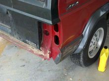 the PO rolled the jeep off the trailer straight into a tree when it got it. destroyed the old tailgate and busted the right tail light assembly...awesome.