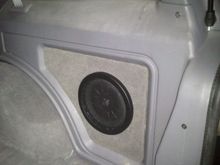 My Kicker CompVT rear cubby sub install.  See my thread here:

http://www.cherokeeforum.com/f67/really-small-subwoofer-install-133158/