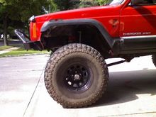 Wrangler fender flares installed and removed about 2 more inches from the fender