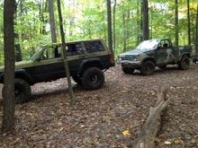 My buddy's Nissan and my xj at his property in  bean blossom