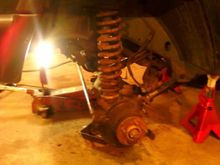 Installing the oversized coil springs.