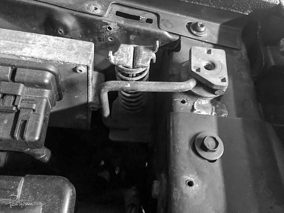 To open the hood without a cable attached, you would have to remove two bolts holding the striker.