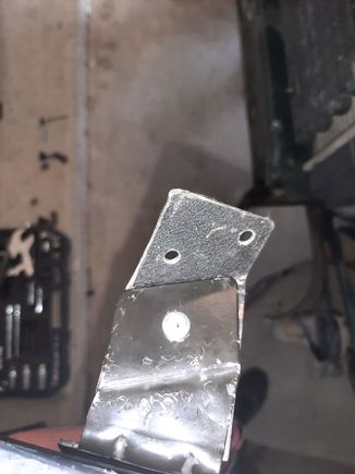 I attached it with a rivit and drilled two holes for bolts