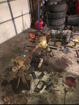 Disassembling the axle. Transmission/T case in the background. 