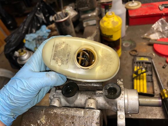 Bench bleeding the master cylinder. Some very nasty old fluid in here that I had to flush first. 