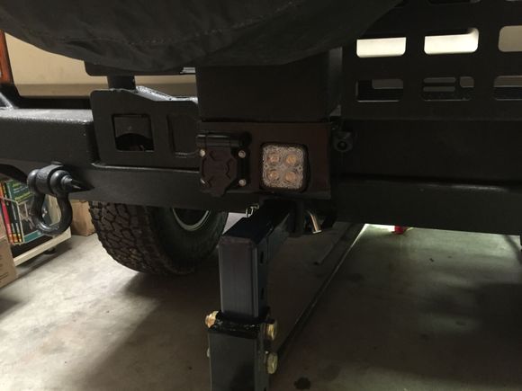 Made a box to hold a reverse light, trailer hookup and the back up camera.