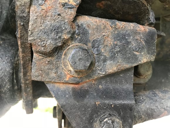 A view of the replacement bolt in the track bar bracket 