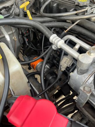 No plug wires from coolant reservoir to engine block. Cleaner IMO