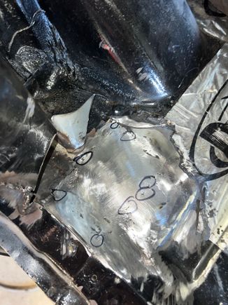 I put a light underneath the panel to find and mark pinholes to be filled after grinding down the initial stitches. 