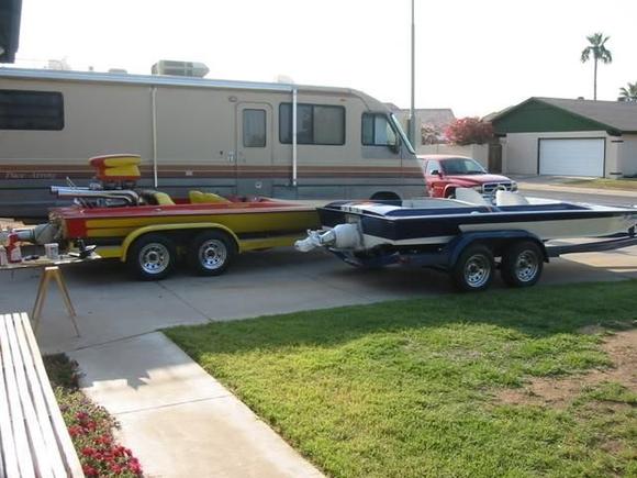 Old and new. Took the motor out of the old one (yellow and orange). Did some fiberglass work, made some new motor mounts, scoop tray, battery box, etc. etc.  Rerigged the blue and white one and put the motor in that one. Recently sold the yellow and orange one.