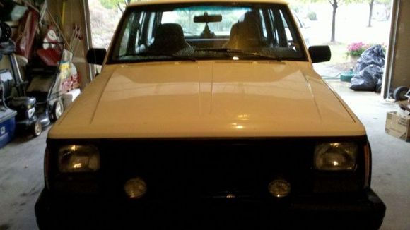 The day I got it... Note the front end damage and the black front clip before I painted it