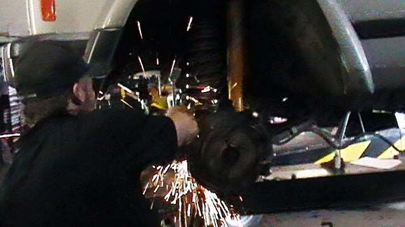 Just cutting off the lower sway link bolts to upgrade the hardware.