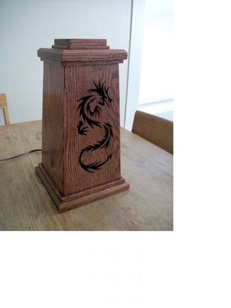Here is the dragon light in the daylight. The cool thing about this is that I made it out of old skid wood. It is all oak that was planed at different thicknesses