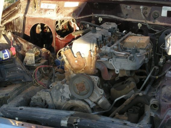 Engine bay, after the heater and A/C systems have been removed