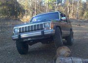 this is right after i bought the tires and before i got the lift, just playin in my buddys yard