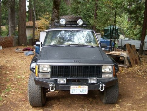 jeep after it rolled got new doors, fenders, bent out roof, and some new paint good as new