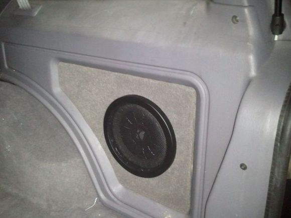 My Kicker CompVT rear cubby sub install.  See my thread here:

http://www.cherokeeforum.com/f67/really-small-subwoofer-install-133158/