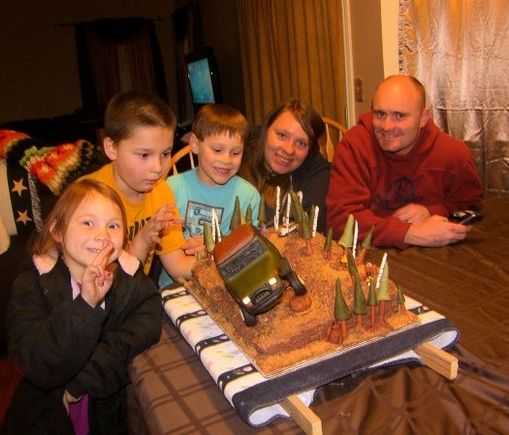 Brad and his family with the cake!