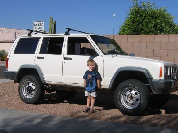 my boy and xj after i installed the lift