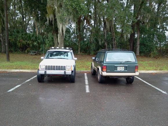 Side x side comparison: both w/ 235/75r15s. White Jeep 15x8 Pacer D window steel wheels w/ 4" bs, Green Jeep w/ OEM 15x7 wheels 5" bs.