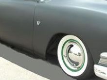 Look sweet with red painted rims on a black car.