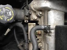 A pair of pliers will get these spring clamps loose 