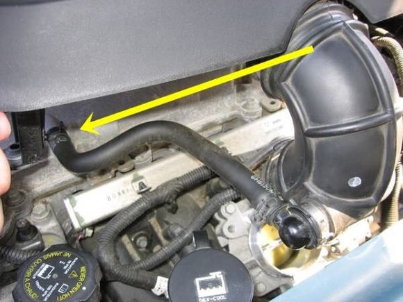 This hose, sometimes the throttle body end , that plastic round piece gets damaged.
Note how the part of the hose parallel to the valve cover is turned up so oil flows back into the valve cover. 
