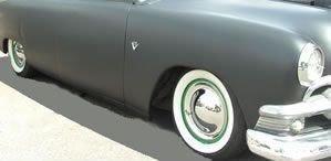 Look sweet with red painted rims on a black car.