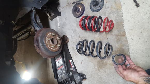 while taking the front apart to lower it, I found a broken coil spring.