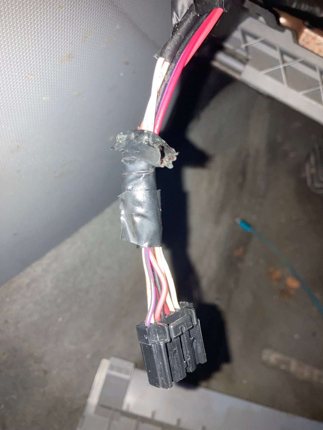 wiring and connector coming out of console , assume to be connected to something 