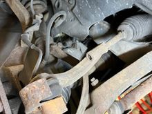 I think there is a similar part here that is connected to the steering part of the wheel that also makes the sqeeking noise