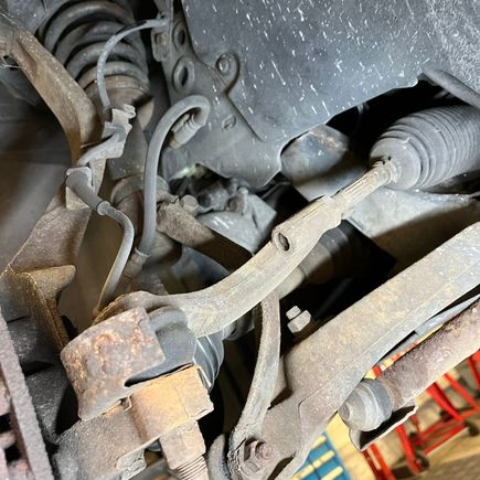 I think there is a similar part here that is connected to the steering part of the wheel that also makes the sqeeking noise