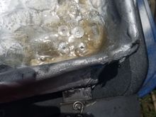 Fiberglass over rivets to help keep them from leaking.