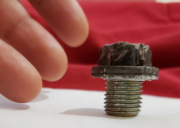 Stripped oil pan drain bolt