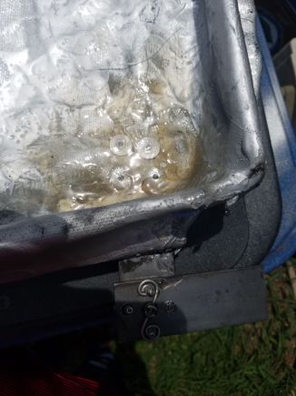 Fiberglass over rivets to help keep them from leaking.