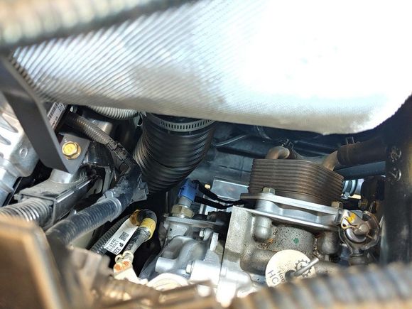 from the backside of the heat shield, the duct going into the bottom of the box