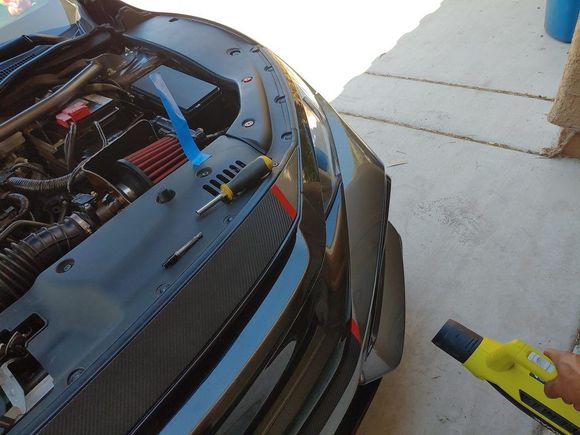 Leaf blower aimed right into the intake funnel in the bumper.