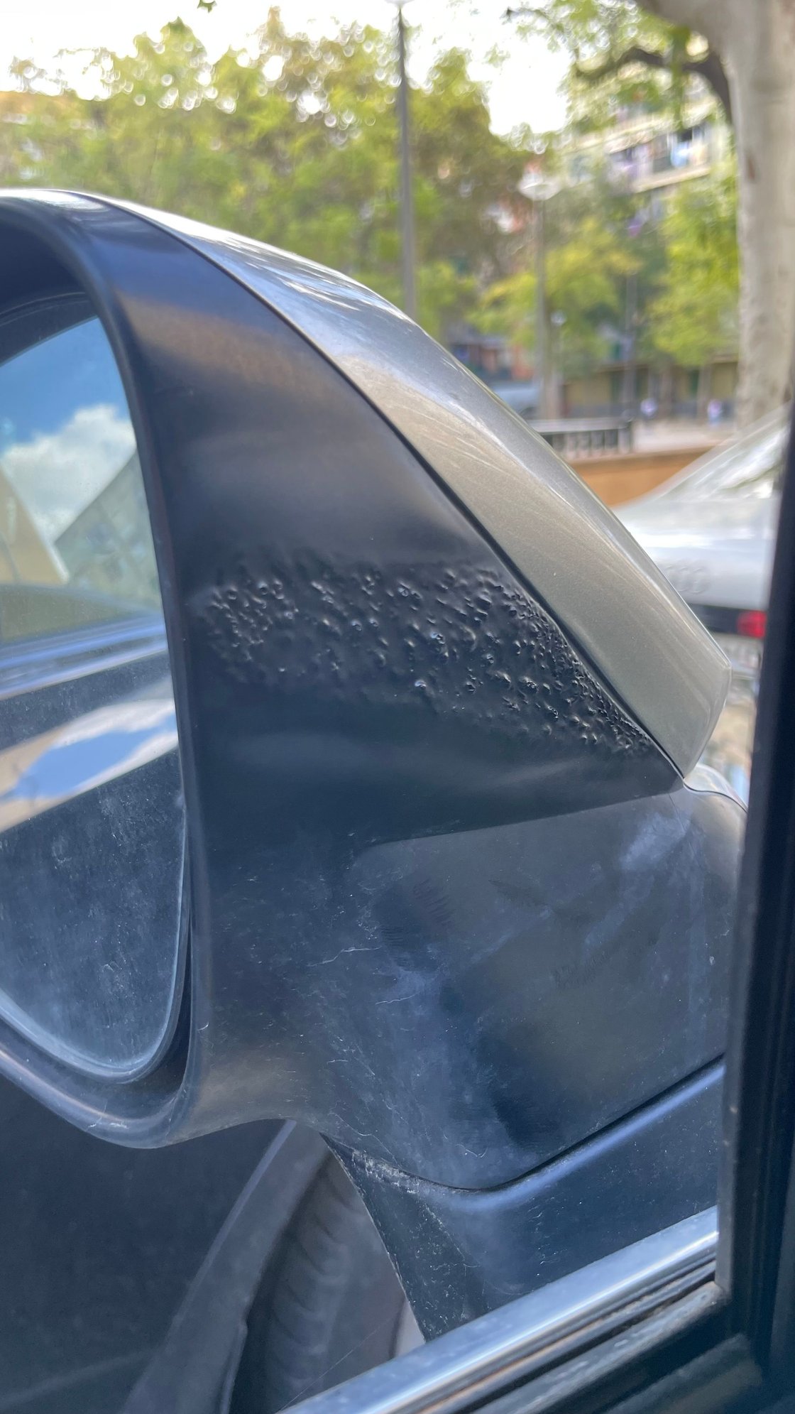 It is a very strange spot and no other material was damaged. This happened while mirrors were closed.