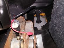 Throttle harness through firewall protected by a 1/4 in hose and a grommet.