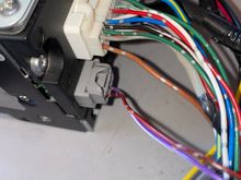 Red/black strip wire is the reverse 12v backup. Apply 12 v to activate and view on screen. 