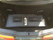 Trunk redone.  Still need to recenter and screw down but looks a ton better and subs sound great now that both are enclosed and sealed.  Subs are dual voice coil 4ohm.  I should have gotten 2ohm since the amp is stable down to 2ohm but the amp is still putting out enough to shake the car.