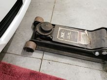 Floor Jack with hockey puck.